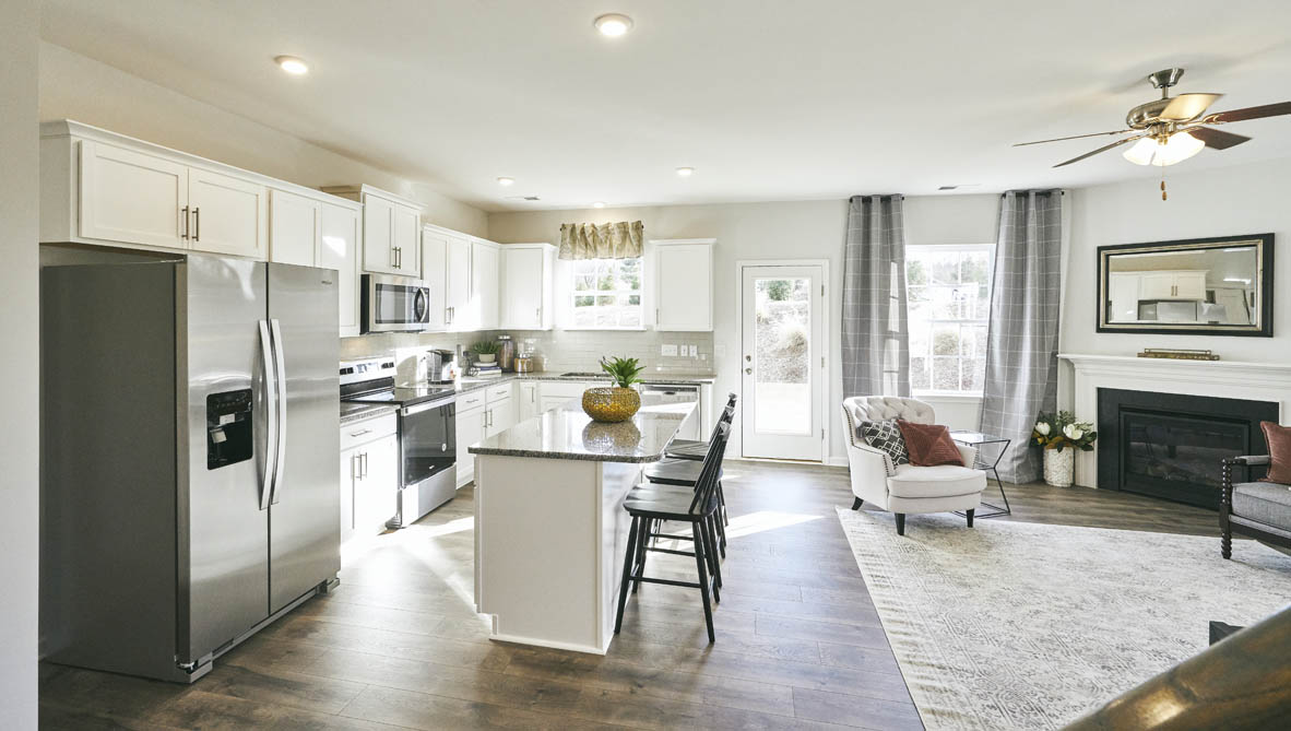 kitchen with revwood, island, and stainless steel appliances
