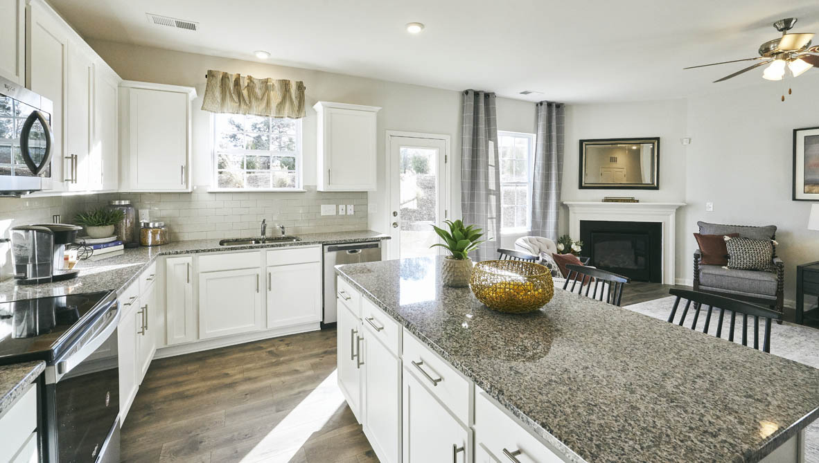 kitchen with revwood, island, and stainless steel appliances