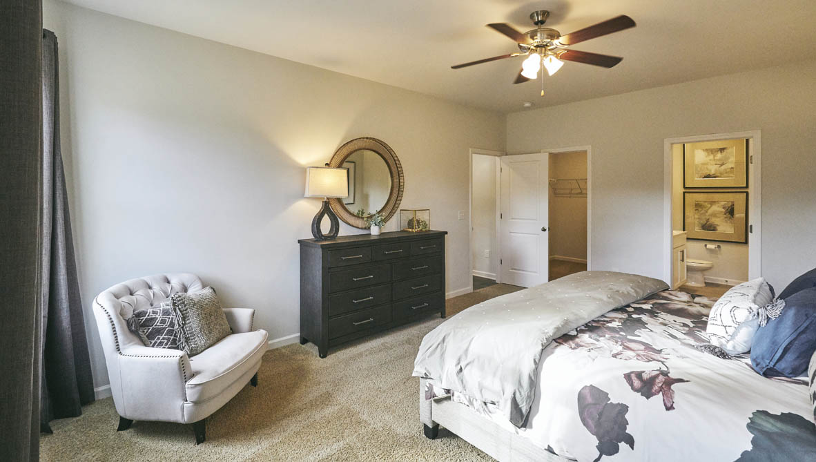 bedroom with carpet and natural light