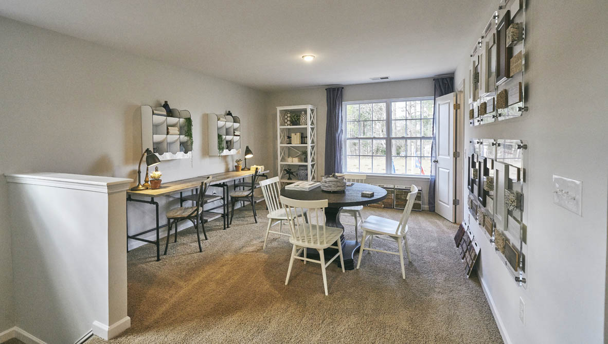 loft with carpet and natural light