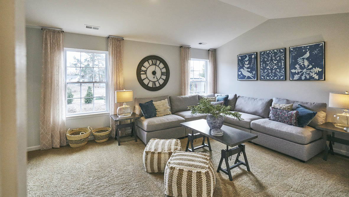 loft with carpet and natural light