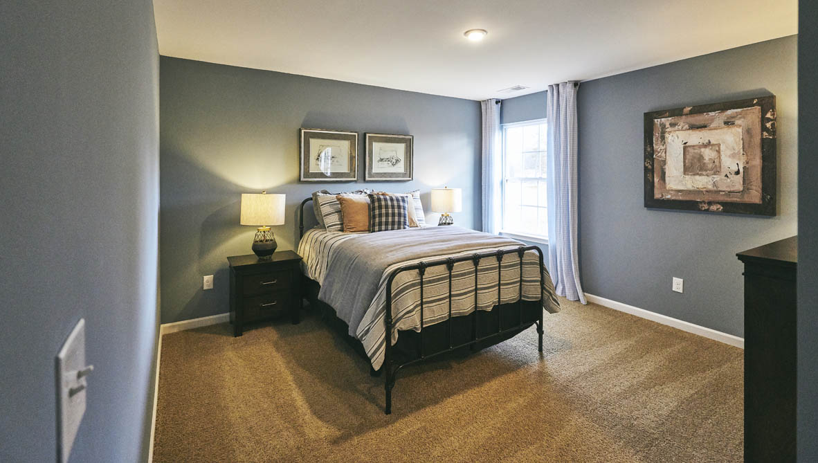 bedroom with carpet and natural light