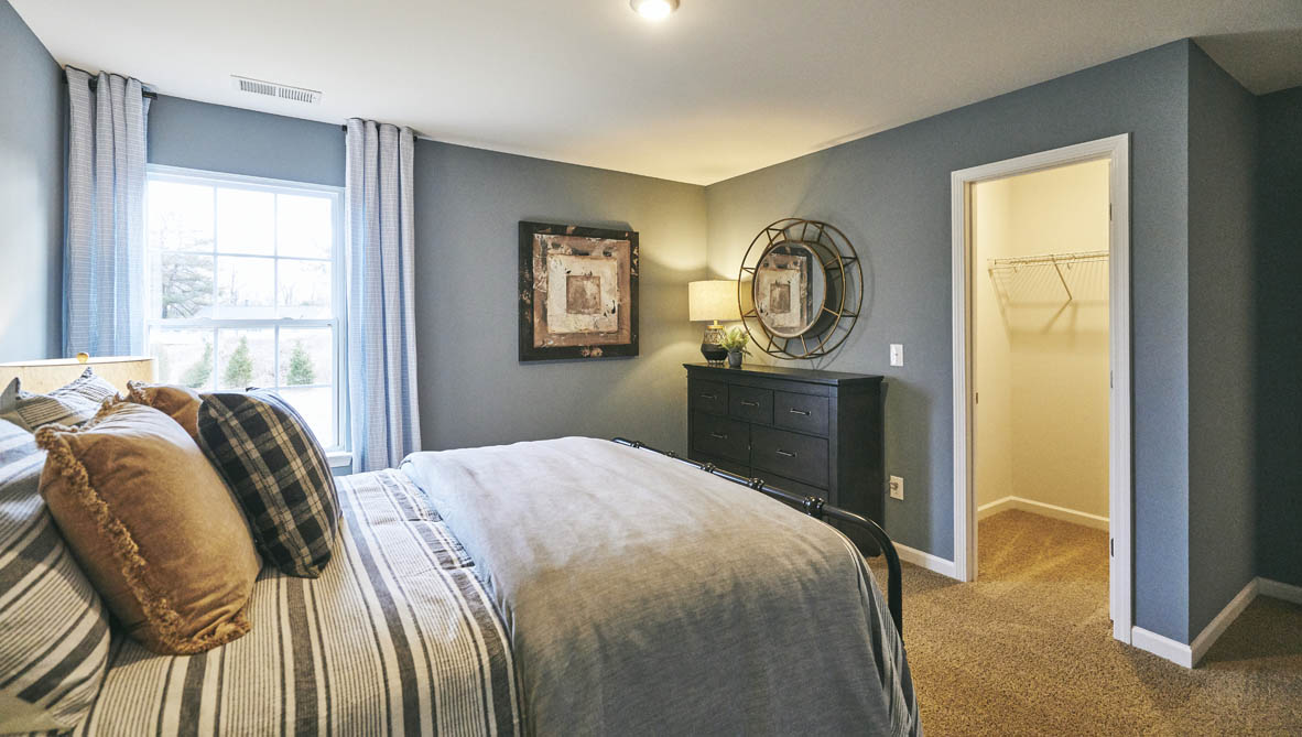 bedroom with carpet and natural light
