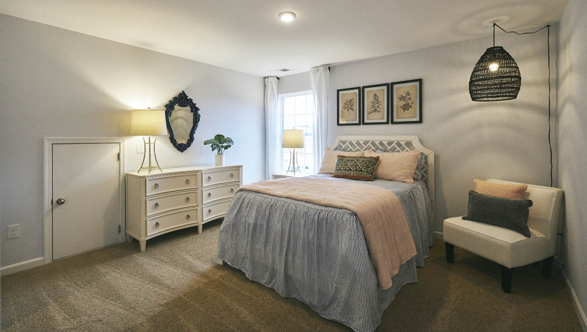 bedroom with carpet and natural light