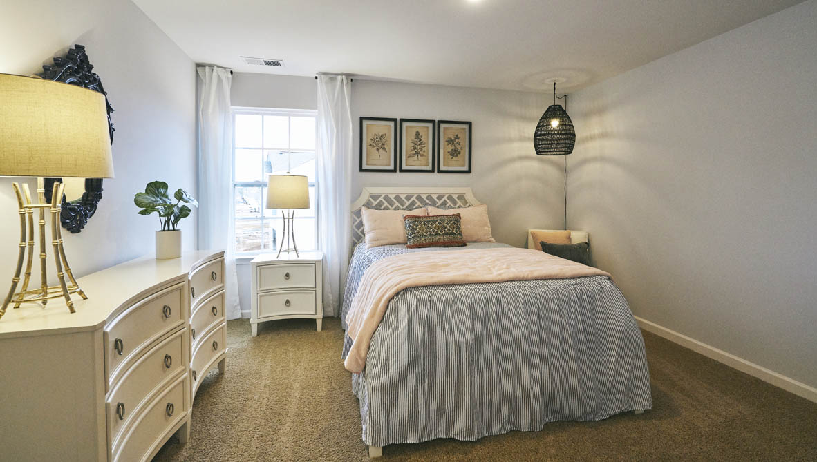 bedroom with carpet and natural light