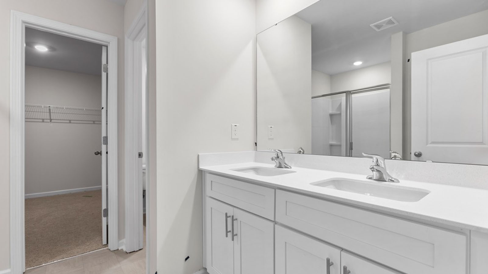 pimary bathroom with dual sinks