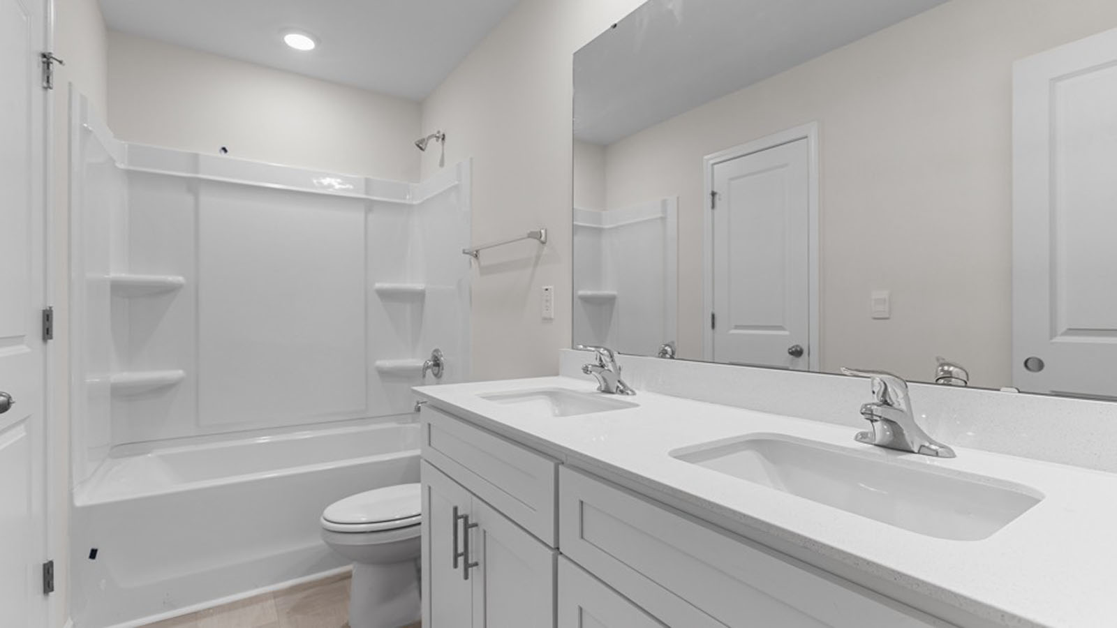 guest bathroom with dual sinks