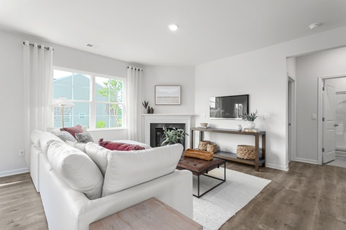 living room with fireplace and revwood floors