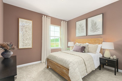 bedroom with carpet and natural light