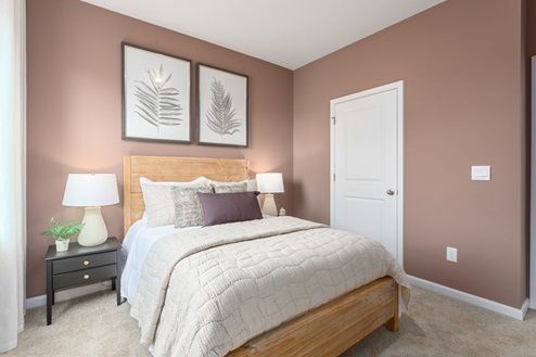 bedroom with carpet and natural light