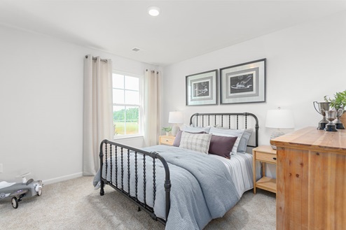 bedroom with carpet and natural light