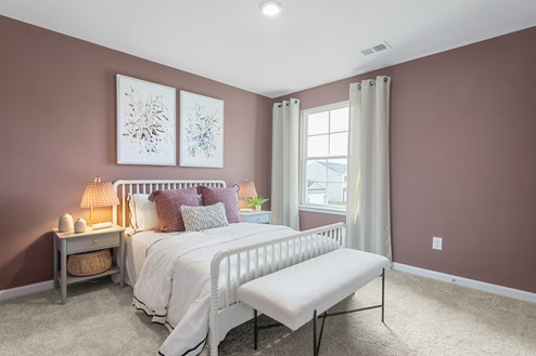 bedroom with carpet and natural light