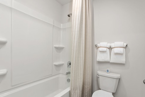 secondary bathroom with tub shower combo