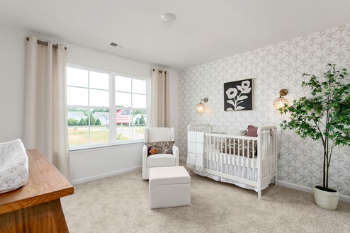 bedroom with carpet and natural light