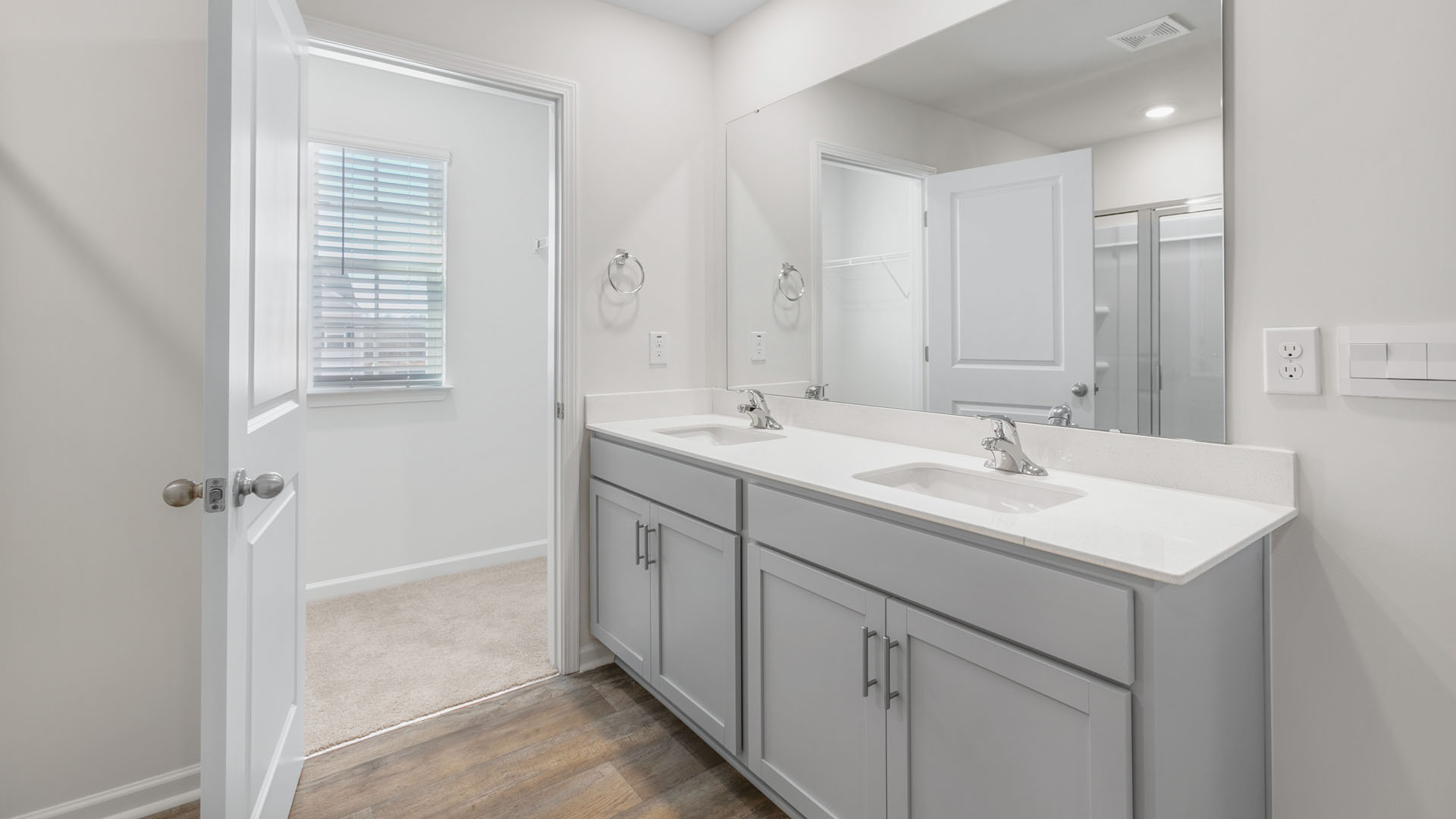 primary bathroom with dual sinks