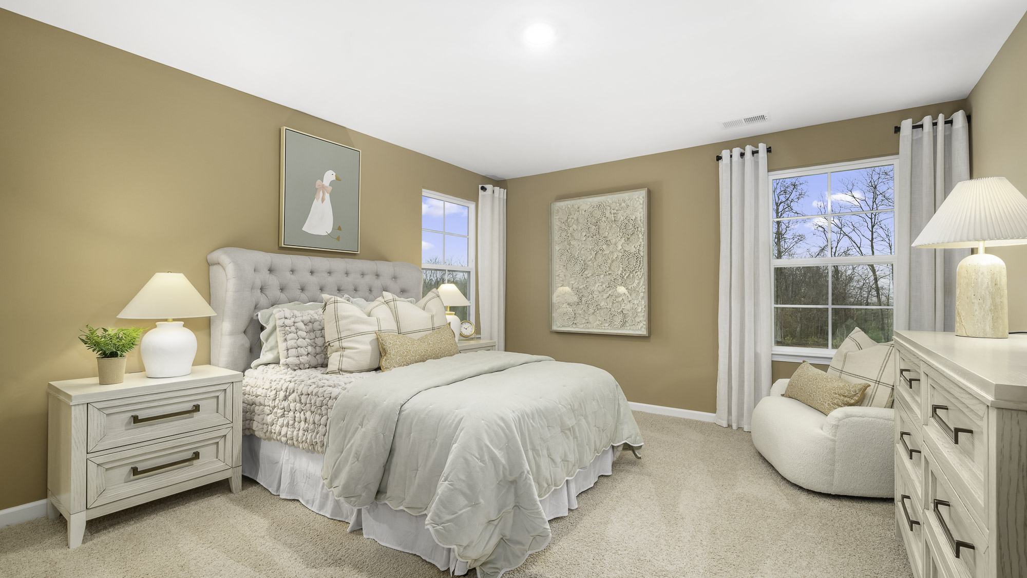 secondary bedroom with carpet and windows