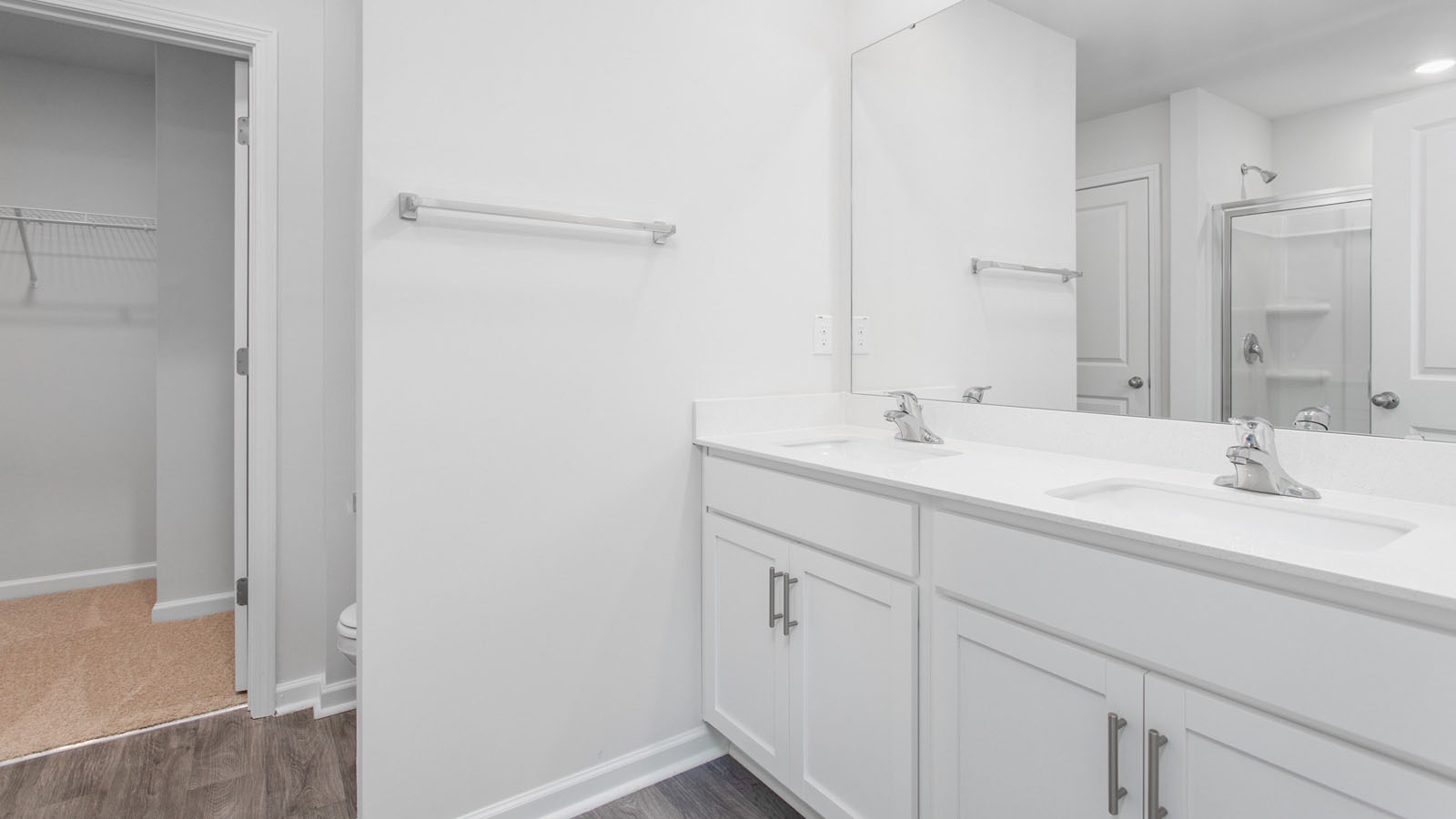 primary bathroom with dual sinks