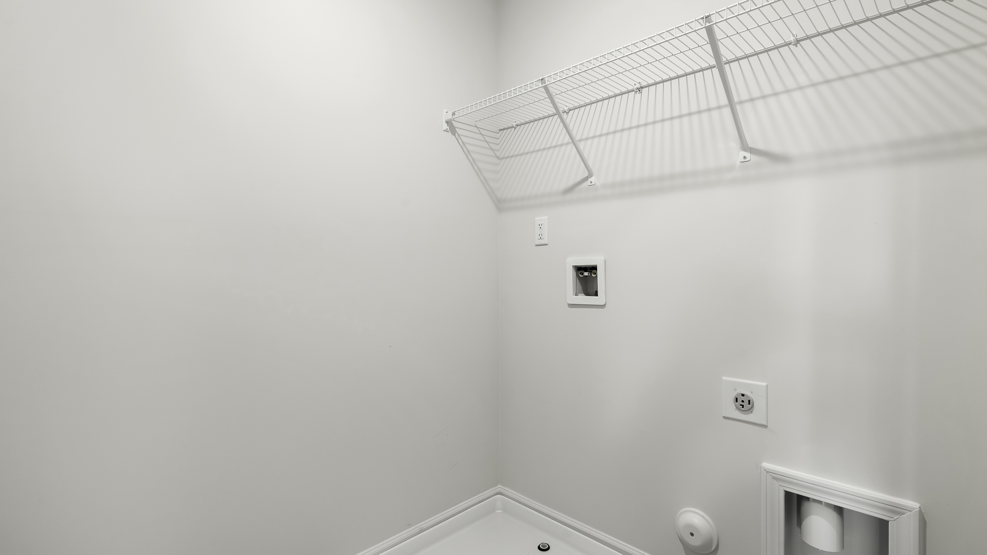 laundry room with wire shelves