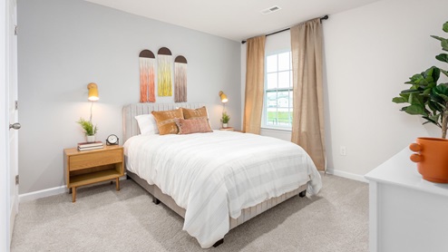 bedroom with carpet and ample light