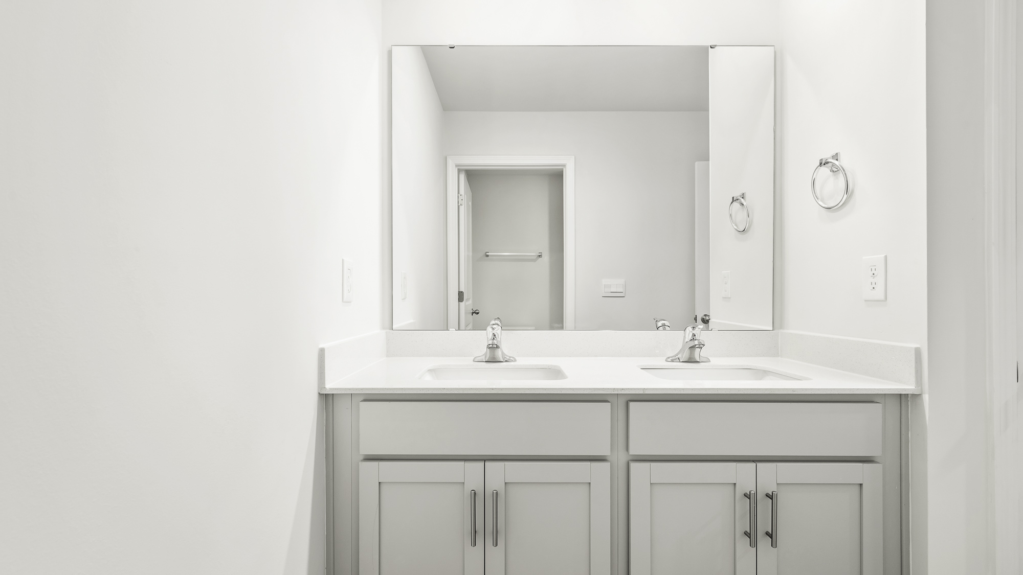 bathroom with dual sinks