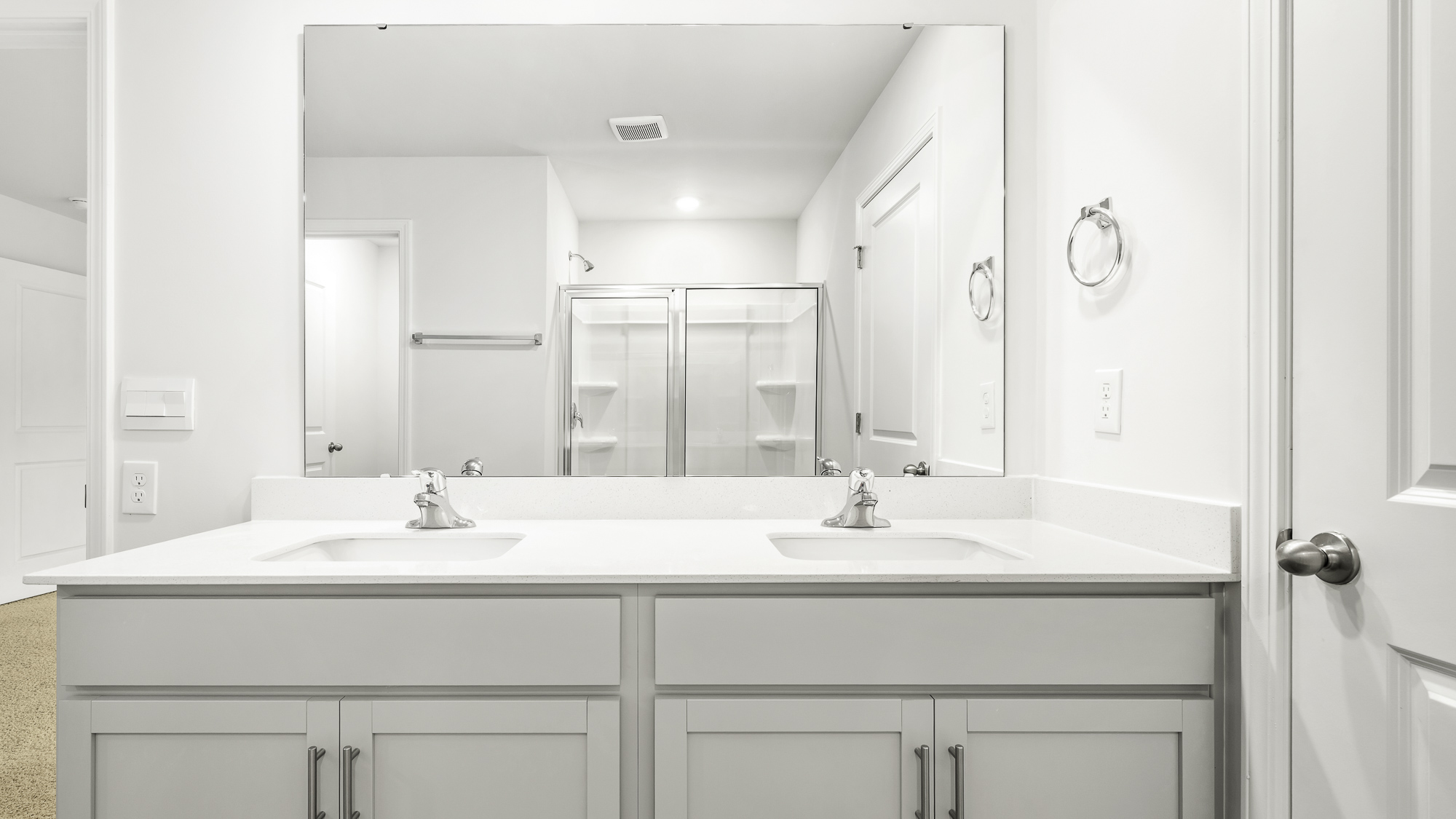 bathroom with dual sinks