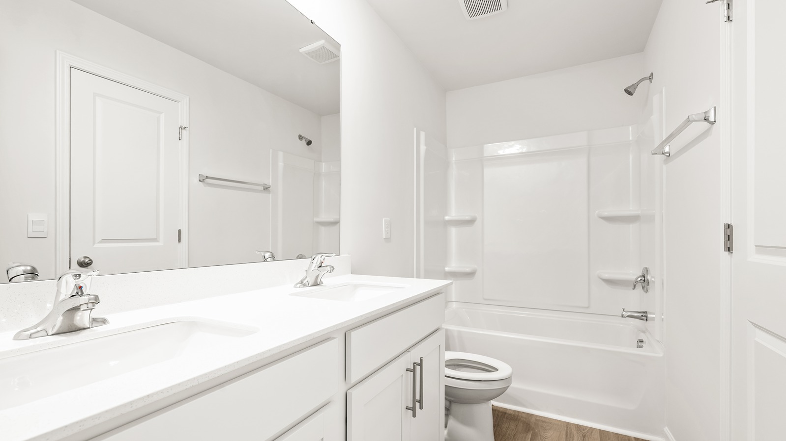 bathroom with dual sinks
