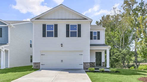 2 story home with white vinyl