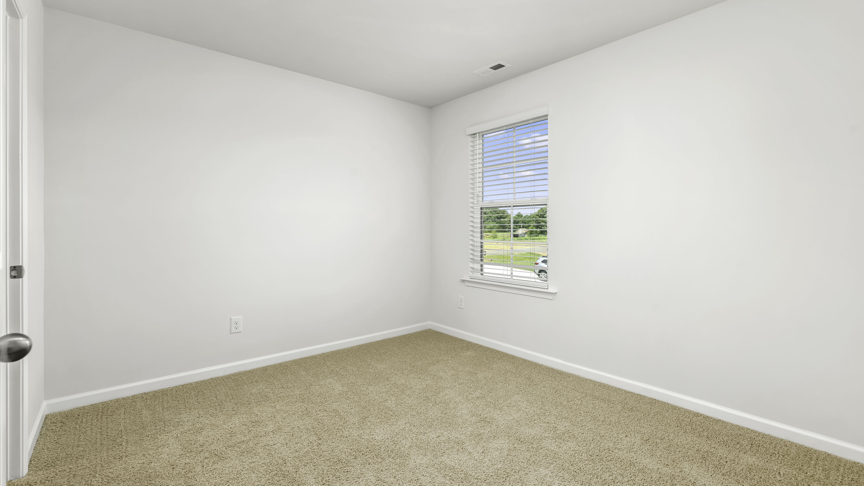 secondary bedroom with carpet