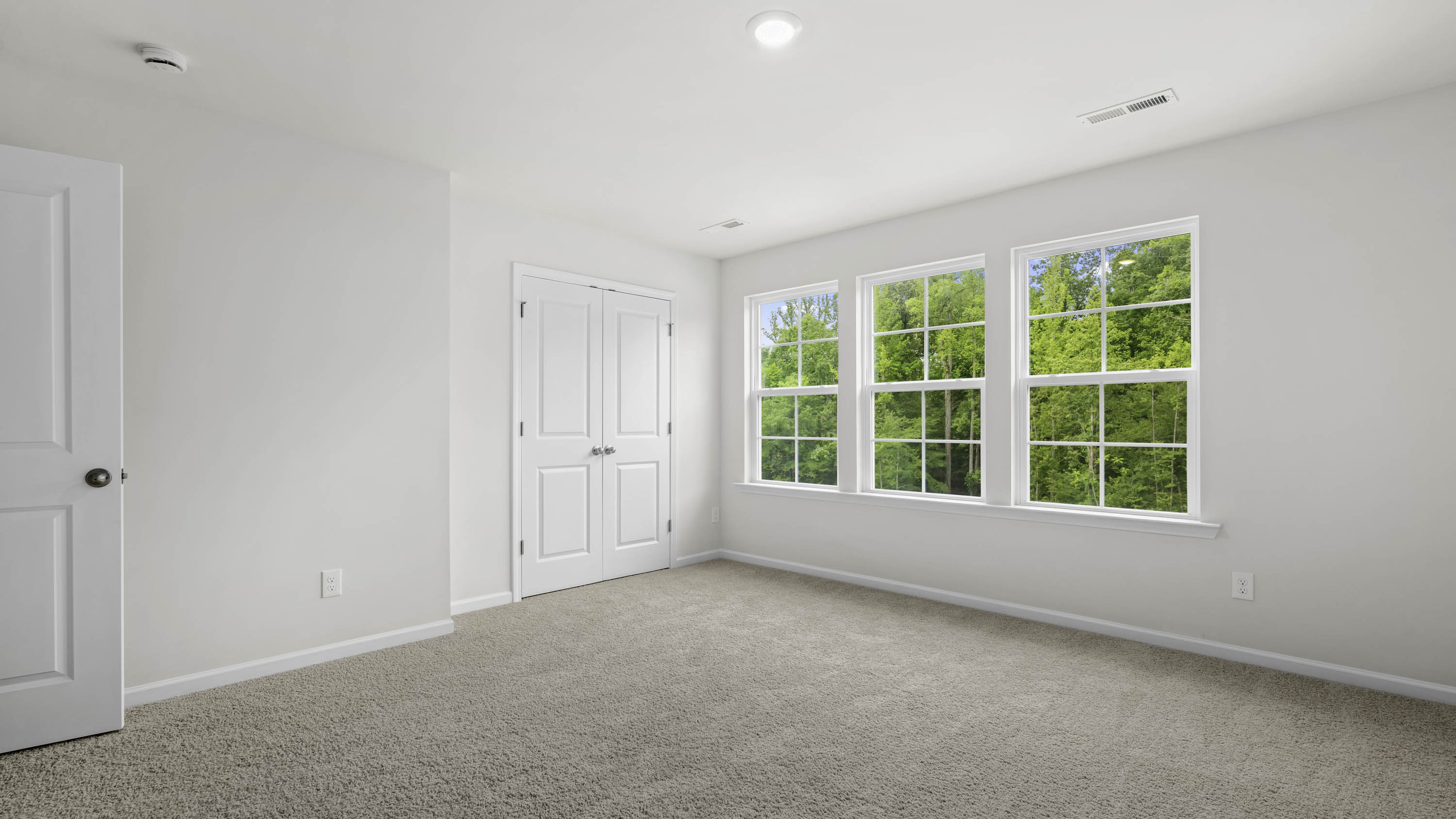 secondary bedroom with windows