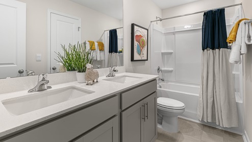 secondary bathroom with tub shower combo