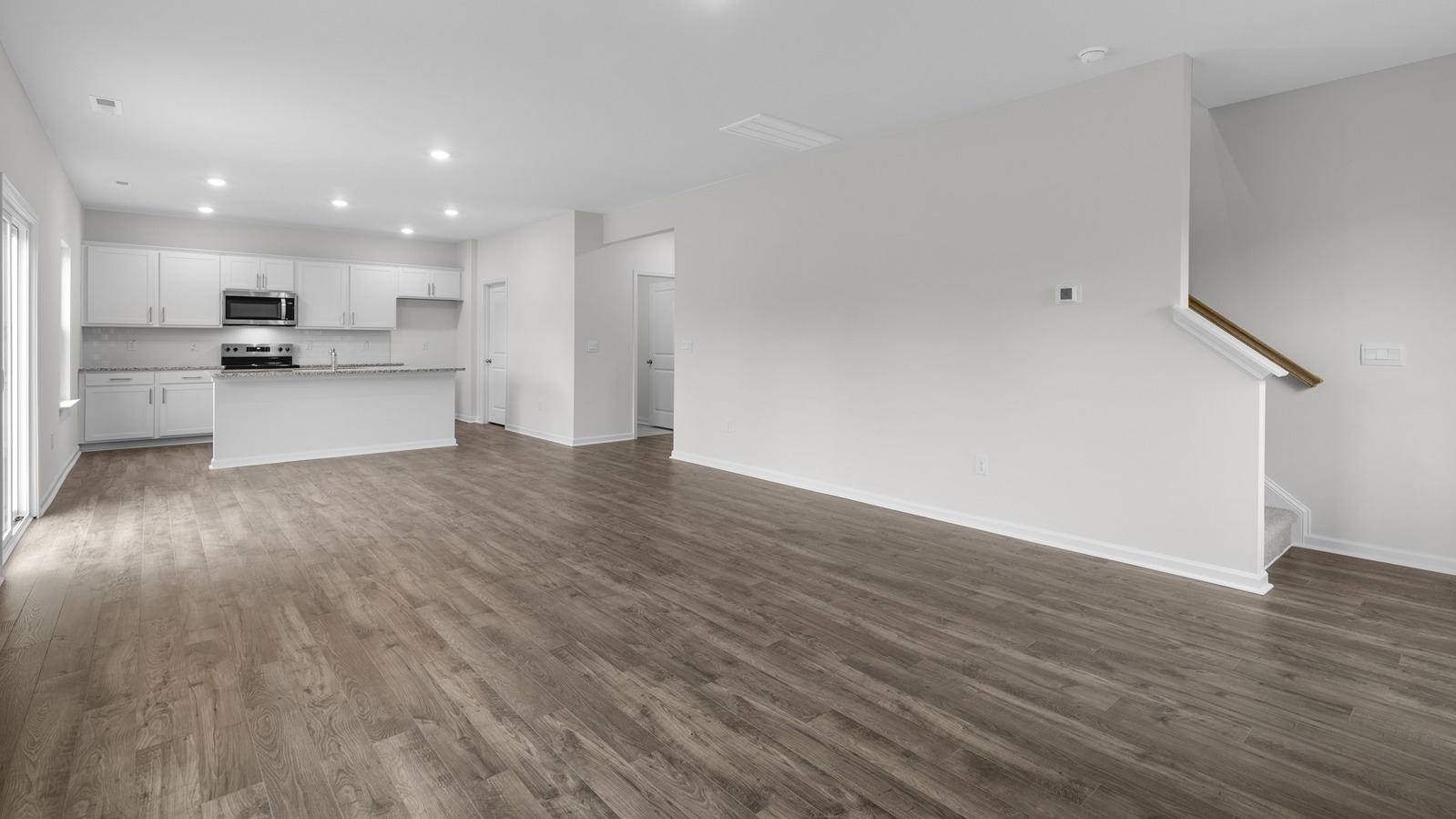 LIVING ROOM WITH KITCHEN VIEW