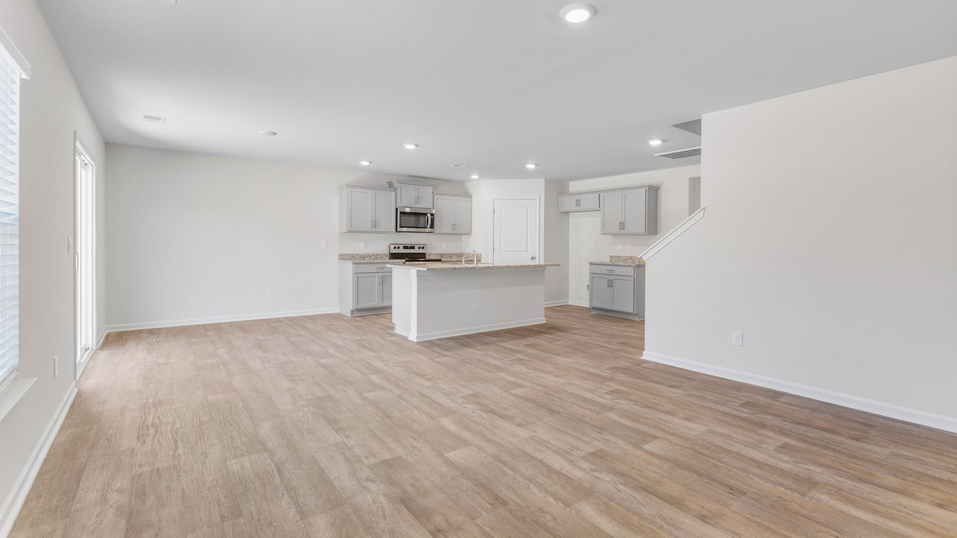 LIVING ROOM WITH KITCHEN VIEW