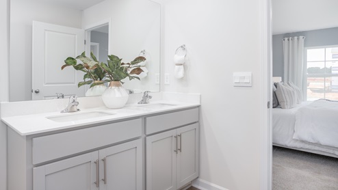 Primary bathroom with dual vanities