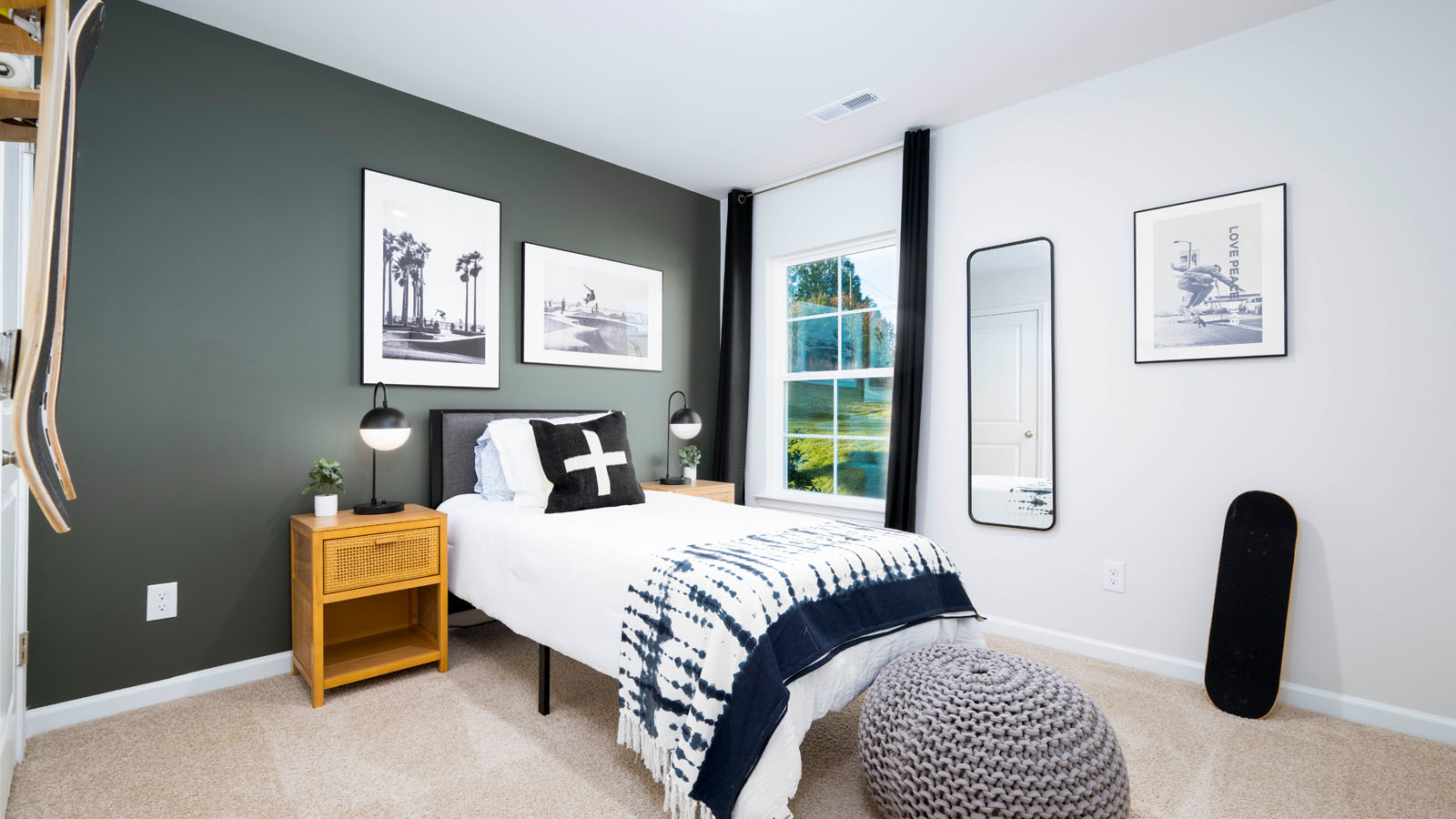 secondary bedroom with carpet and window