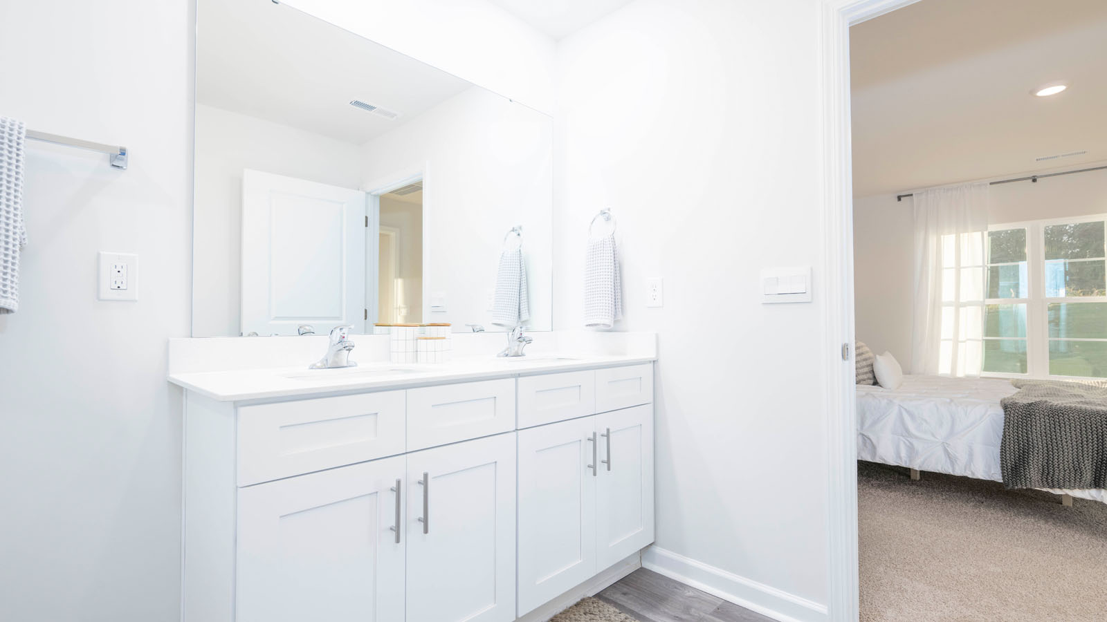 primary bathroom with dual sinks