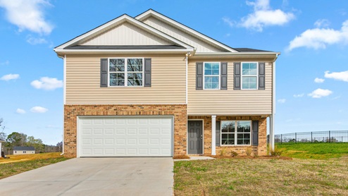 Two story home with brick on the front
