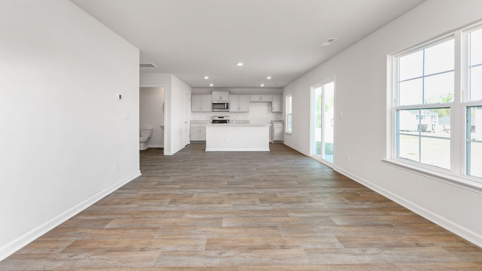 living and partial kitchen view