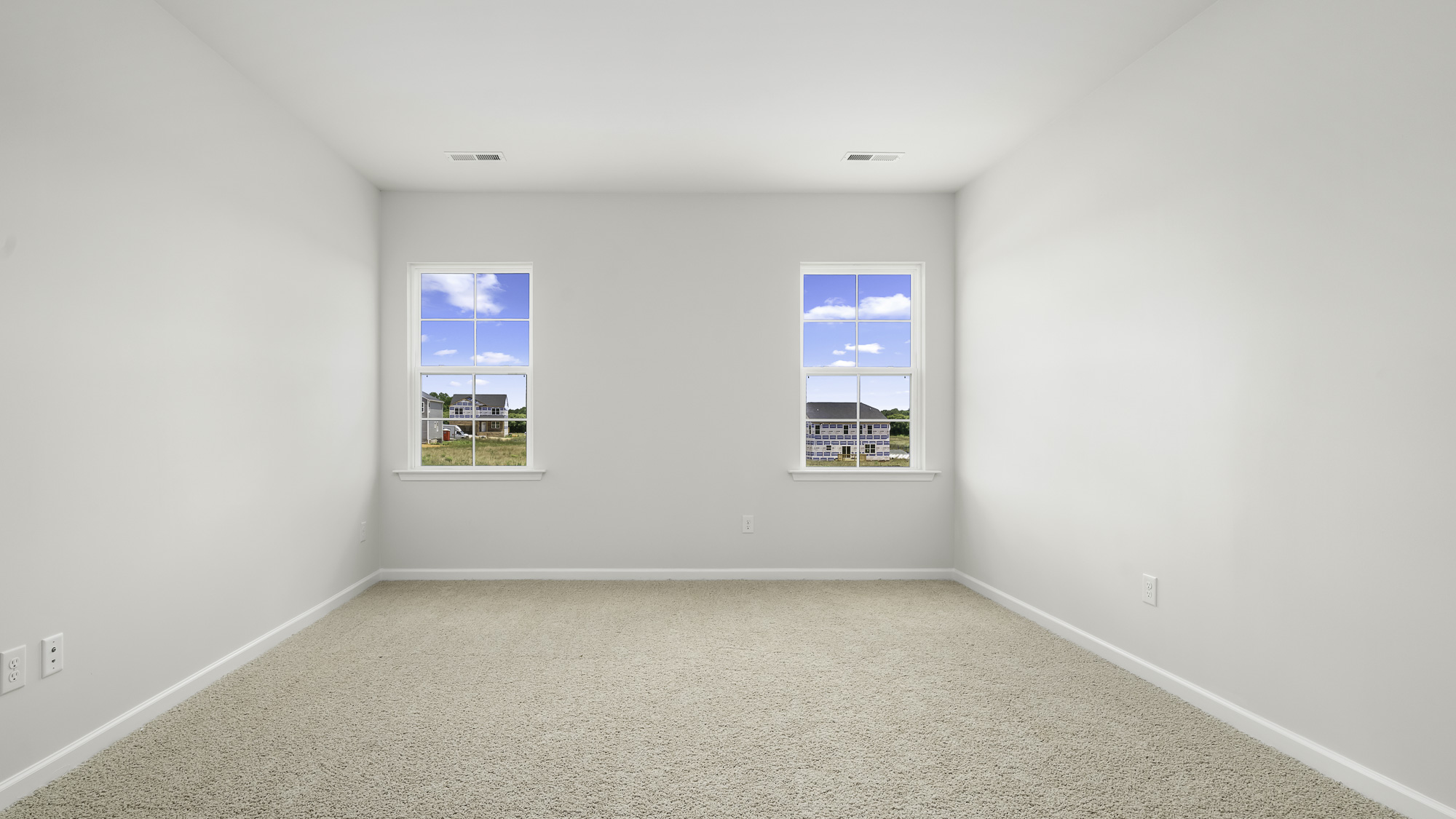 primary bedroom with windows
