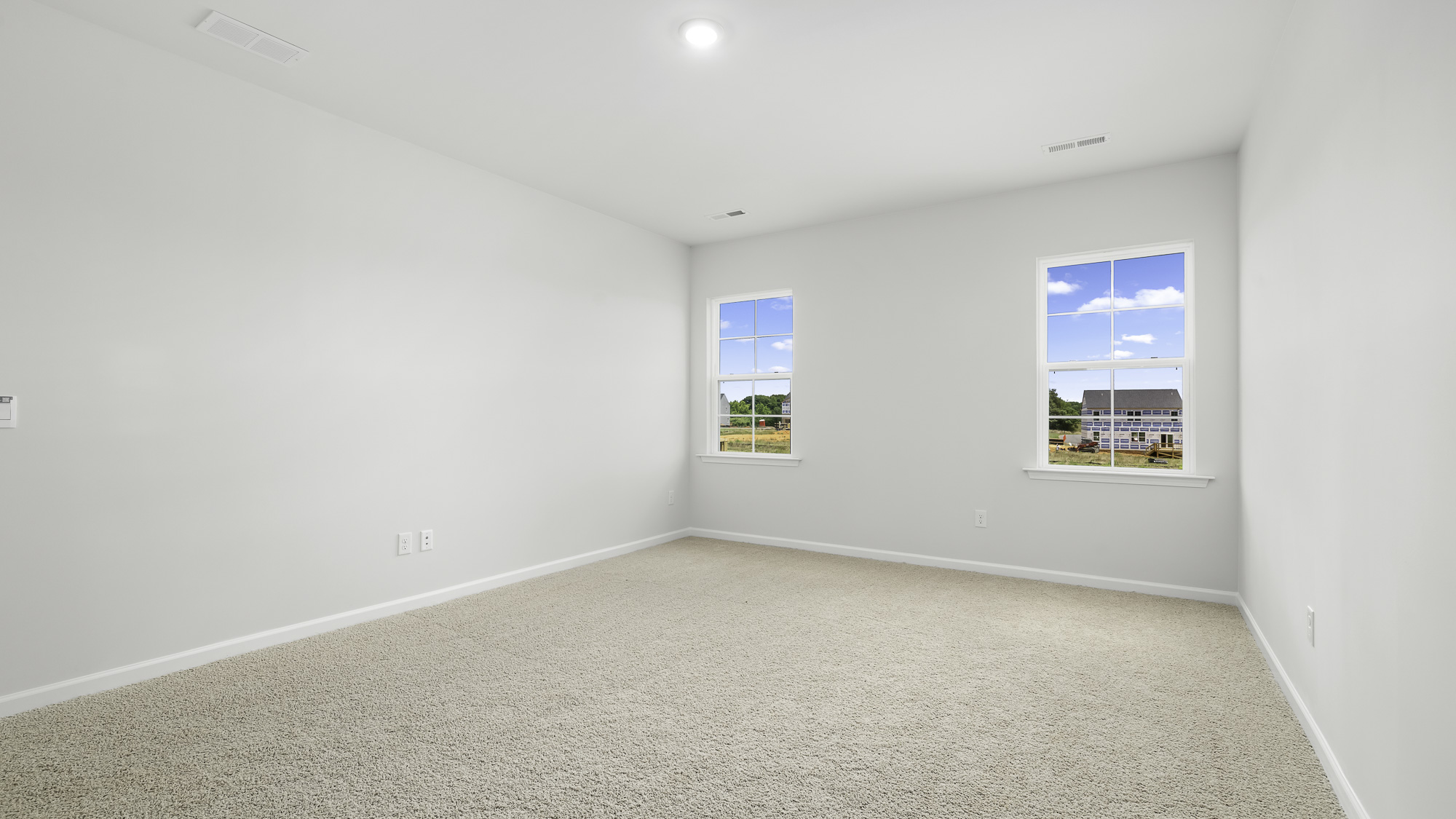 primary bedroom with carpet