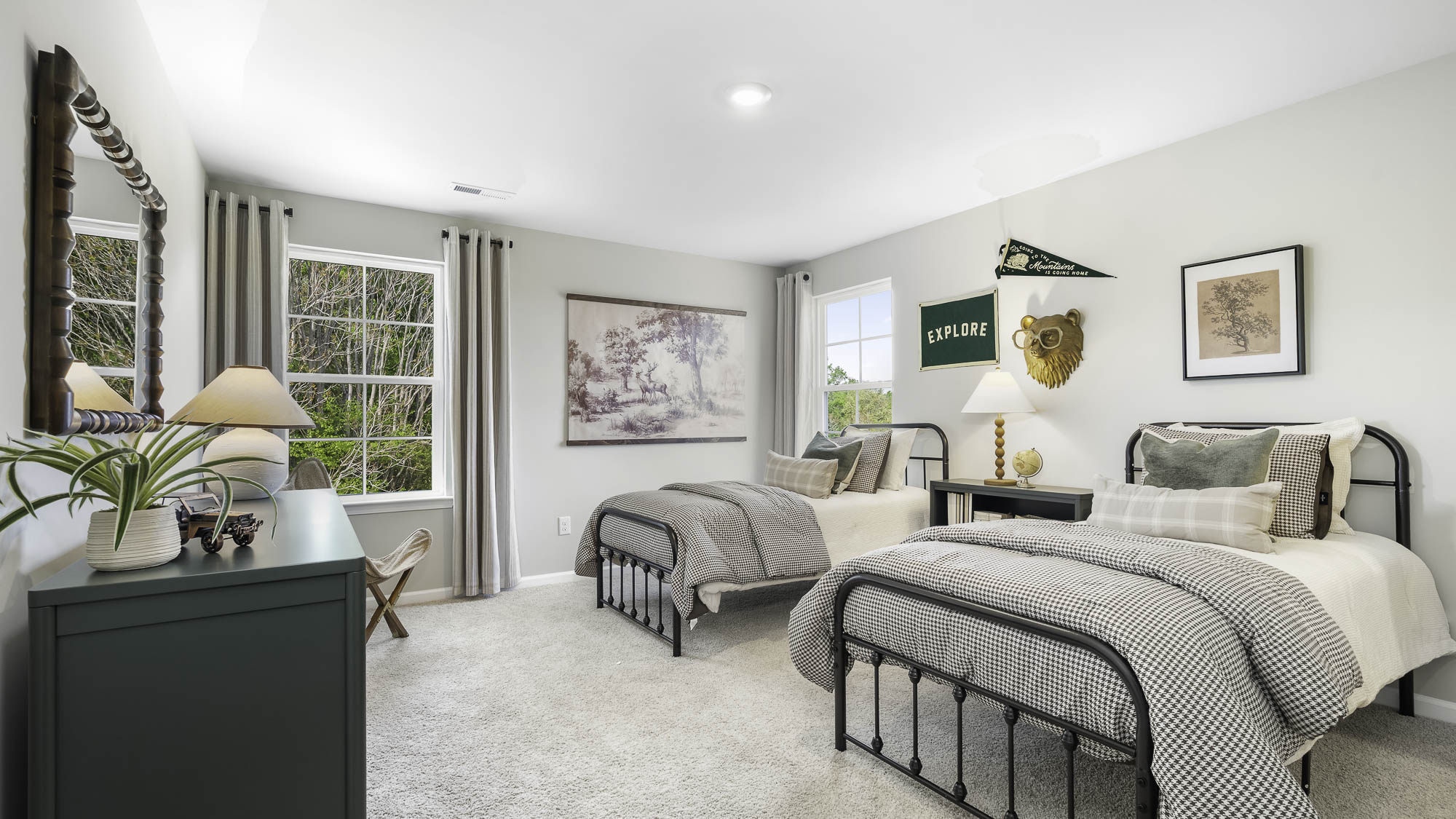 secondary bedroom with carpet and window