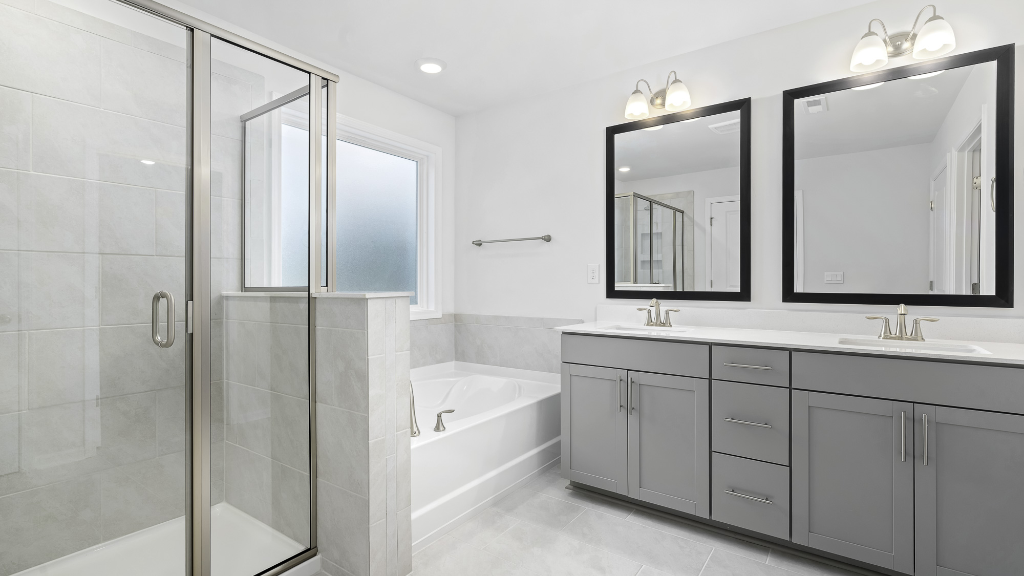 primary bathroom with dual sinks