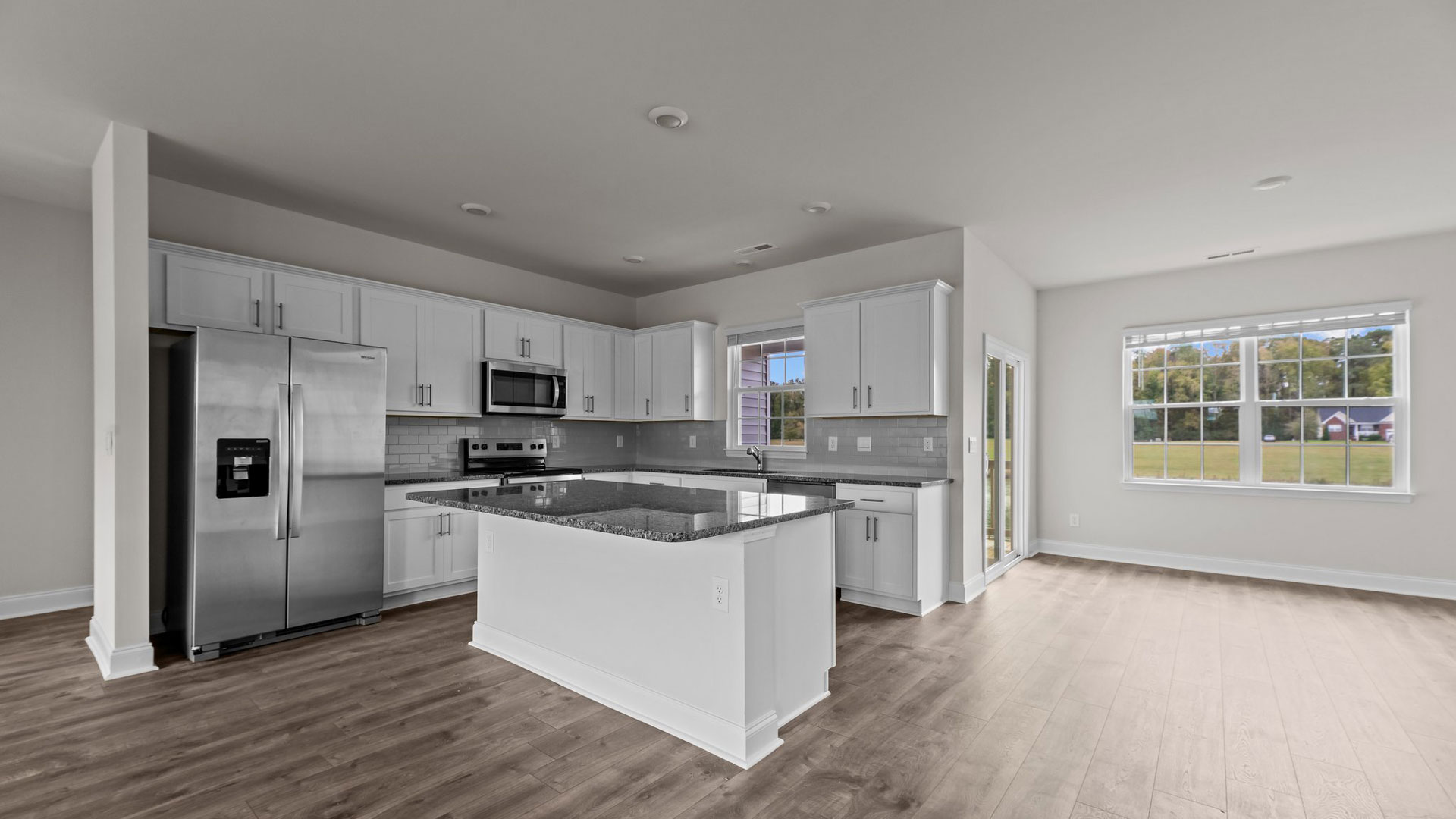 side kitchen view and dining room