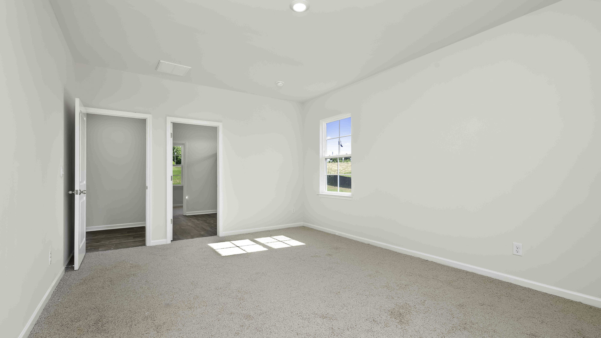 primary bedroom with carpet