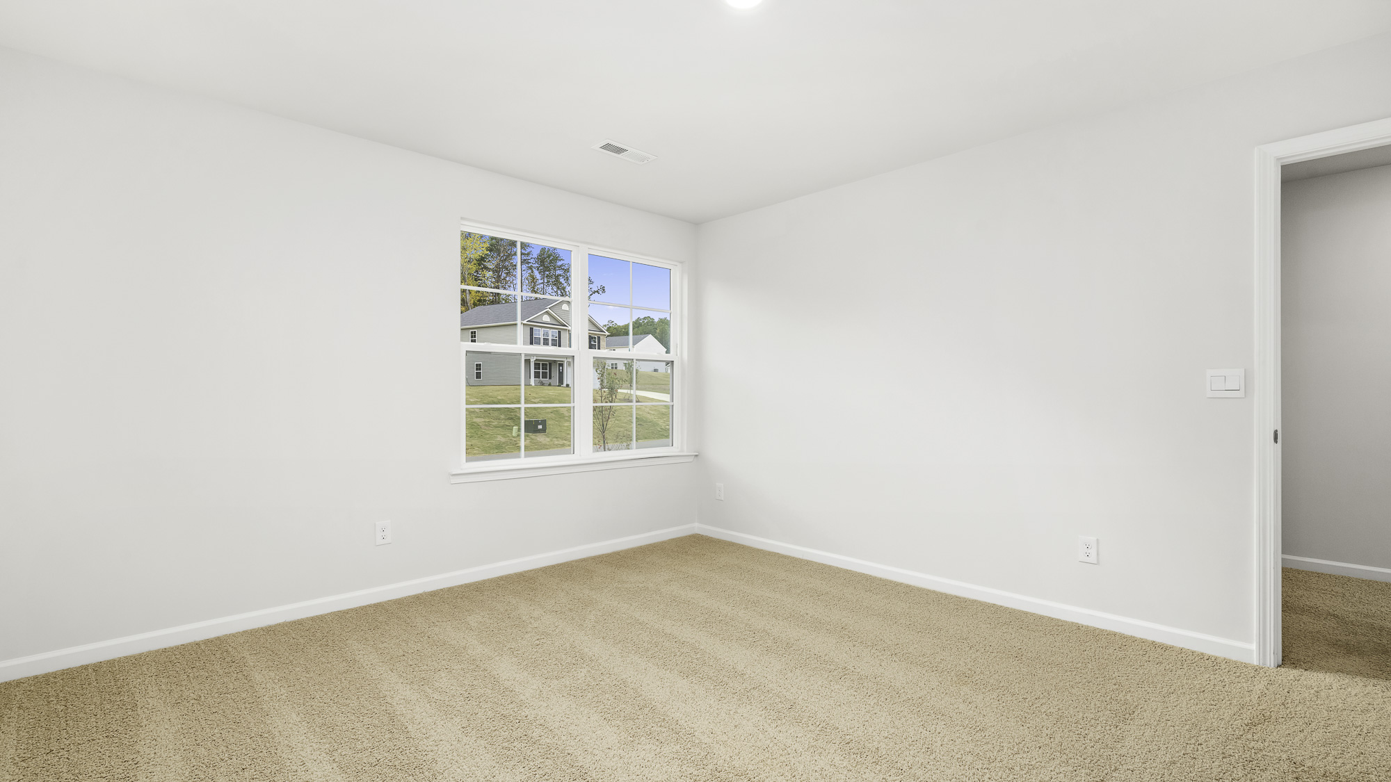 primary bedroom with carpet