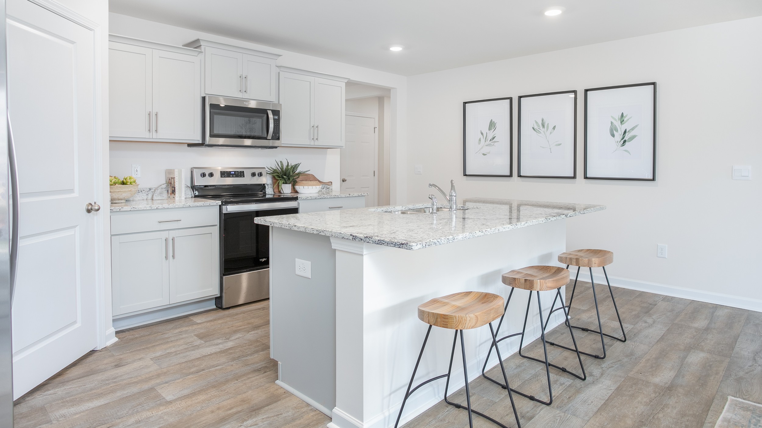 kitchen with a sit in island and stainless steel