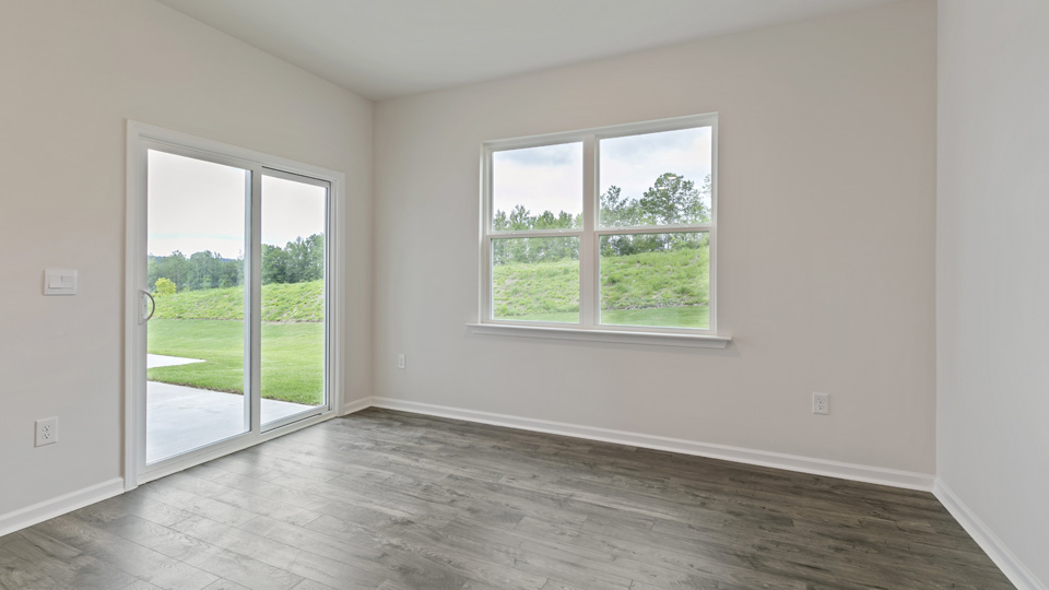 open concept dining space with sliding glass door to patio