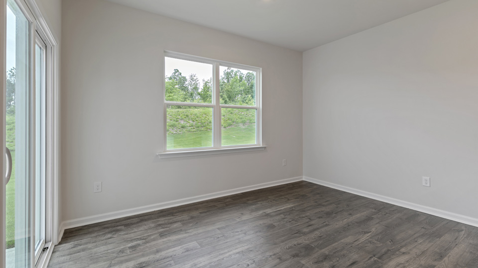 open concept dining space with sliding glass door to patio