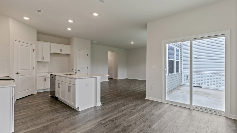 open concept dining space with sliding glass door to patio