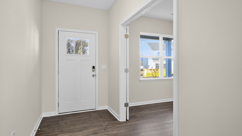 foyer entryway with revwood flooring
