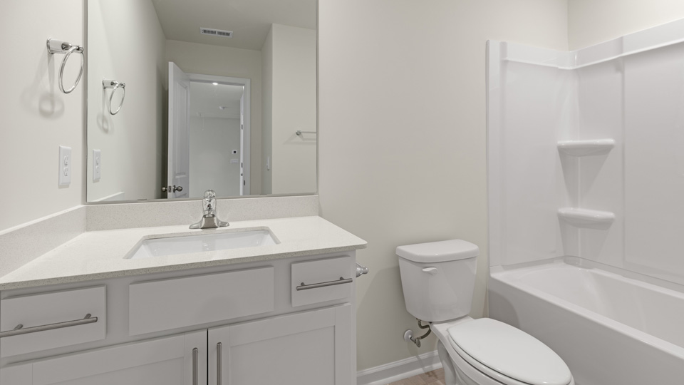 Bathroom with white cabinets
